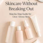 “Flat lay of layered skincare products with blog title text ‘How to Layer Skincare Without Breaking Out’ on a soft beige background”