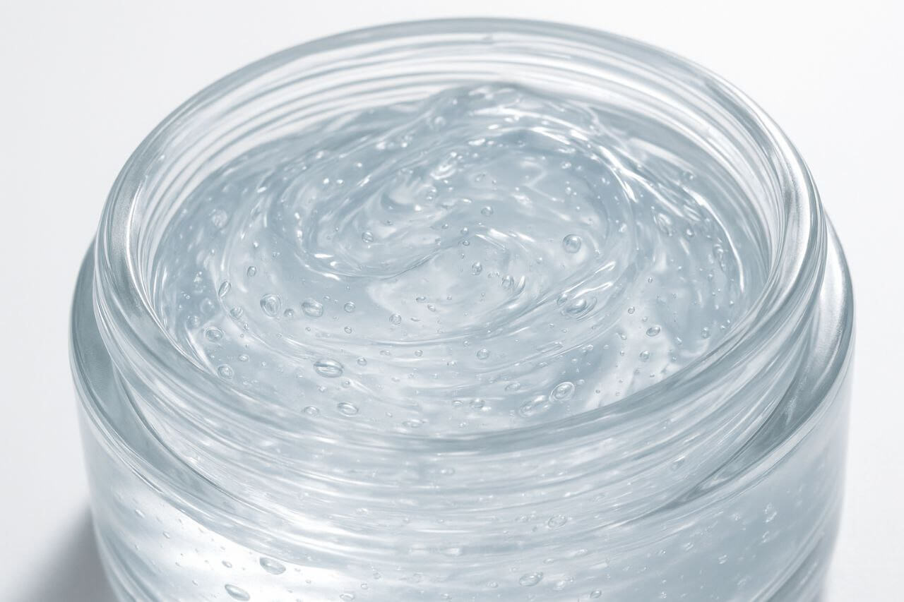 Clear gel moisturizer texture in a glass jar.