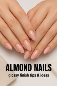 Hands with almond-shaped nails featuring a glossy finish in nude or pastel shades, styled in a clean and elegant studio setting with soft lighting.