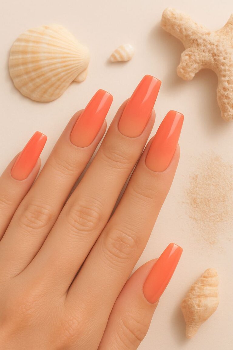 “Close-up of coral ombré nails with beach-inspired gradient design, glossy summer style”